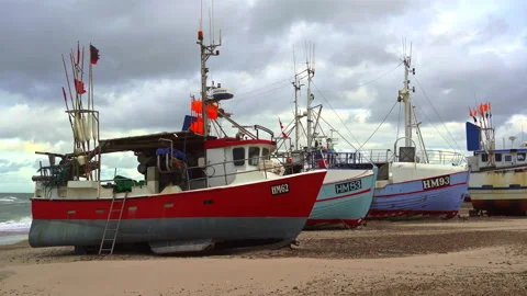Fishing boats pulled ashore before the arrival of a late summer storm Stock Footage 162256850