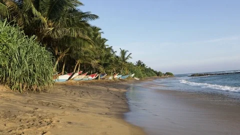 Fishing boats stranded on beach Stock Footage 71563655