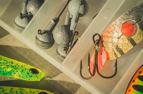 Fishing box with a set of loads, hooks and baits. Fishing accessories. Fisherman Stock Photos