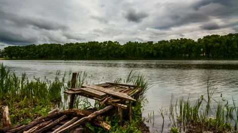 Fishing bridge on a small river. Time Lapse. Stock Footage 66255643