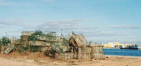 Fishing cages on a dock in a harbor Stock Footage 124297534