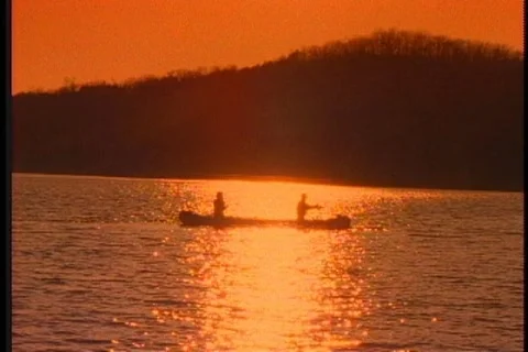 Fishing from a canoe Stock Footage 137555