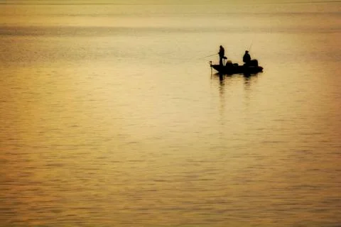 Fishing at dawn Stock Photos
