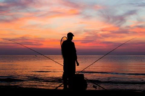 Fishing at dawn Stock Photos