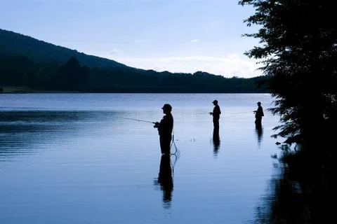 Fishing at daybreak Stock Photos