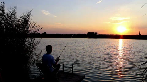 Fishing during sunset Video stock 31824683