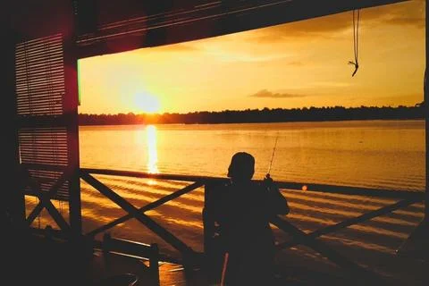 Fishing during sunset Fotos de archivo