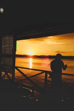Fishing during sunset Fotos de archivo