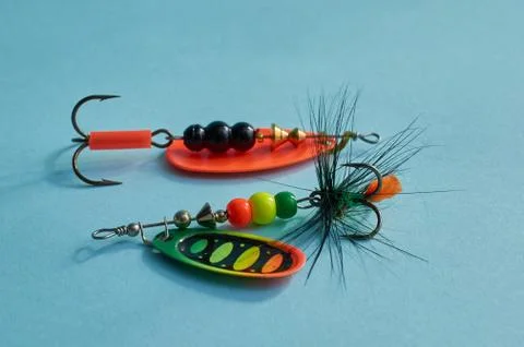 Fishing equipment. Two multi-colored fishing lure with a hook close-up Stock Photos