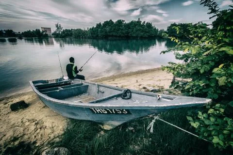 Fishing at estuary Photos
