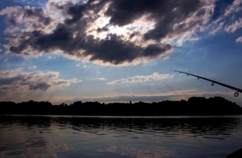 Fishing in evening Stock Photos