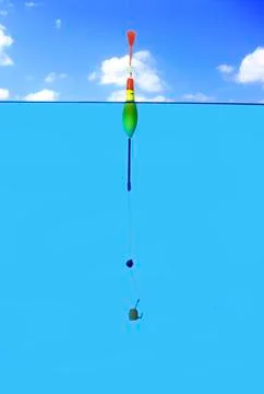 Fishing float and hook in water Stock Photos