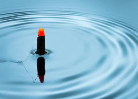 Fishing float signalling bite Stock Photos