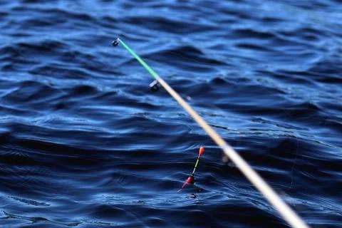 Fishing float on the water Stock Photos