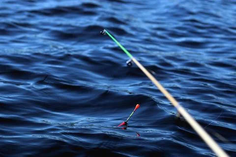 Fishing float on the water Stock Photos