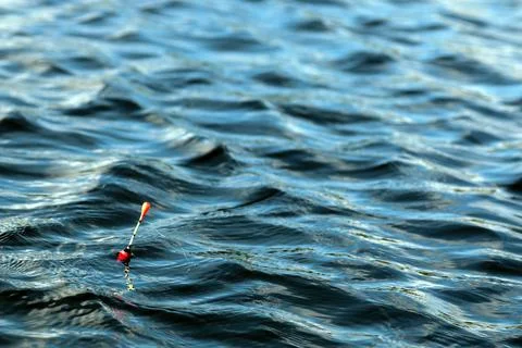 Fishing float on the water Stock Photos