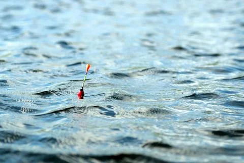Fishing float on the water Stock Photos