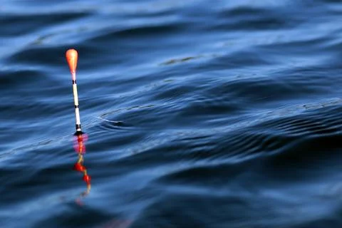 Fishing float on the water Stock Photos