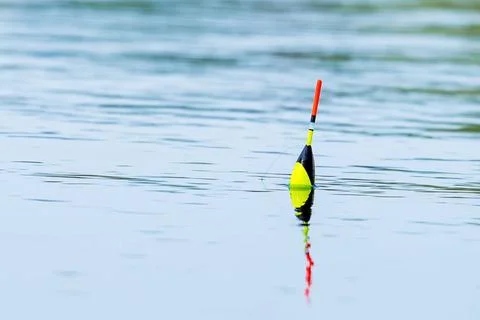 Fishing float on the water surface in close-up. Spring fishing on fresh wa... Foto stock