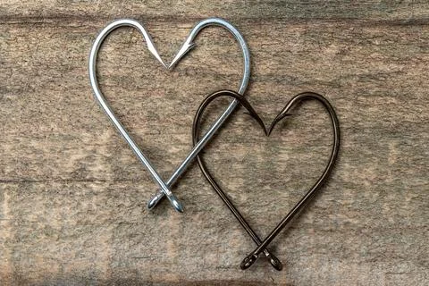 Fishing hook. Hearts. Stock Photos