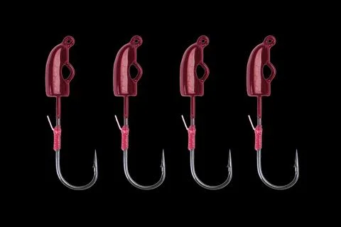 Fishing hook isolated on a black background. Jig fishing hook close up. Fis.. Stock Photos