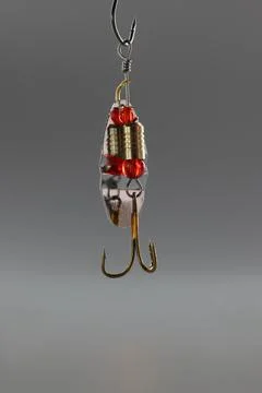 Fishing hook, sharp tip of hook, construction to catch fish in river or lake Stock Photos