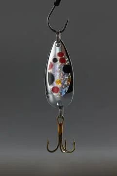 Fishing hook, sharp tip of hook, equipment to catch fish in lake or river water Stock Photos