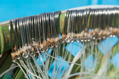 Fishing hooks on the net Foto stock