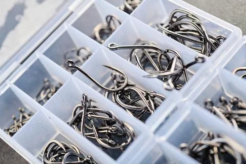 Fishing hooks in a plastic box Stock Photos