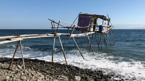 Fishing hut on the beach Stock Footage 99721751