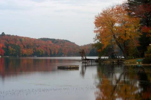 Fishing on lake in fall Stock Photos