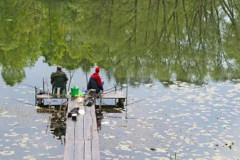 Fishing in a lake Stock Photos