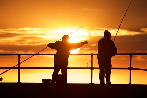 Fishing men at the beach Stock-Fotos