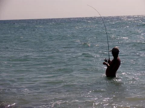 Fishing at the middle of the beach 스톡 사진