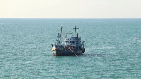 Fishing Motor Boat And Distant Military Ship Stock Footage 86310235