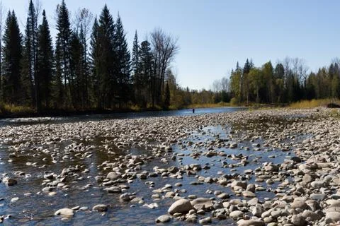 Fishing on the mountain river with fast current Foto stock