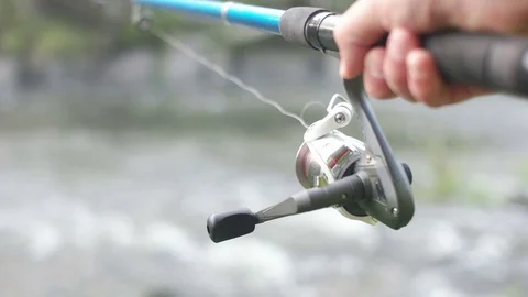Fishing on the mountain river, slow motion, close-up Stock Footage