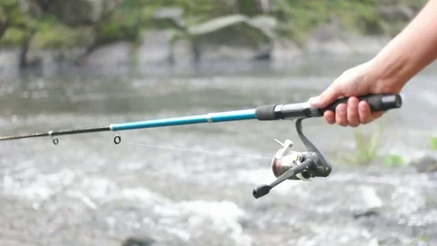 Fishing on the mountain river, slow motion Stock Footage