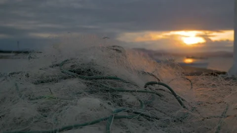Fishing net and small boat along a pier at sunset in Florianopolis, Brazil Stock Footage 231543724