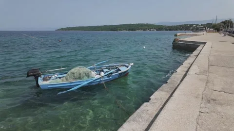 Fishing net and various equipments rocking in a blue boat Stock Footage 344752225