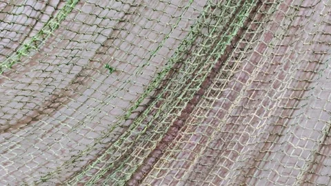 The fishing net is like a background on the wall. Video stock 289436227