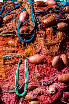 Fishing net with the beach Stock Photos