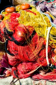 Fishing net with the beach Stock Photos