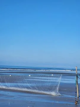 Fishing Net on the Beach Stock Photos