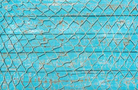 Fishing net on blue background Stock Photos