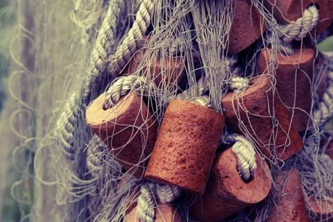 Fishing net with cork floats Stock Photos