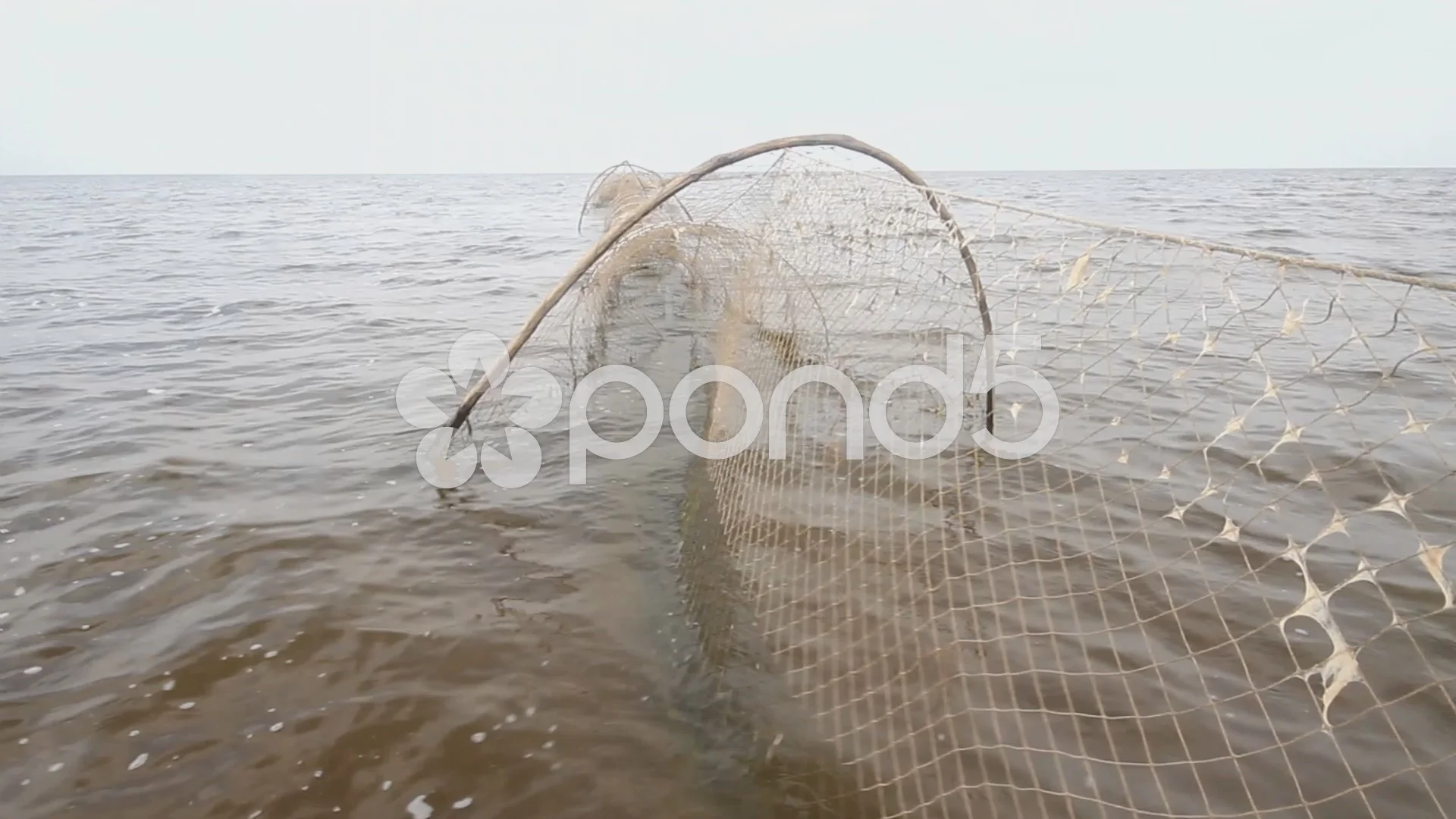 fishing net a fish-trap on lake, Stock Video