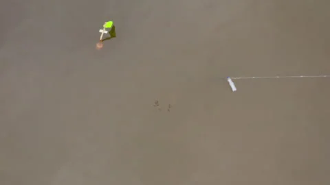 Fishing net marking pole with green flag floating in the Baltic Sea. Video stock 296481168