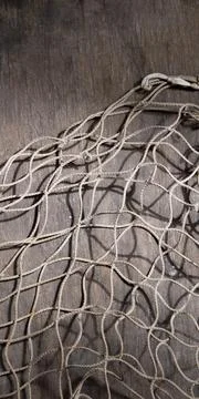 Fishing net on rustic old wood, fishing concept, art craft themes Stock Photos