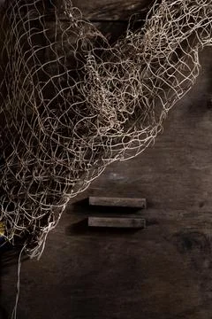 Fishing net on rustic old wood, fishing concept, art craft themes Stock Photos
